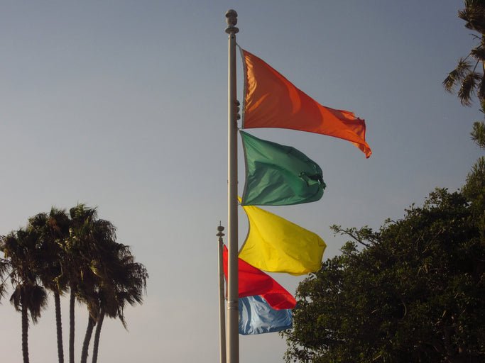 The Essential Beach Flag Pole Guide for 2026 - Lounge Wagon